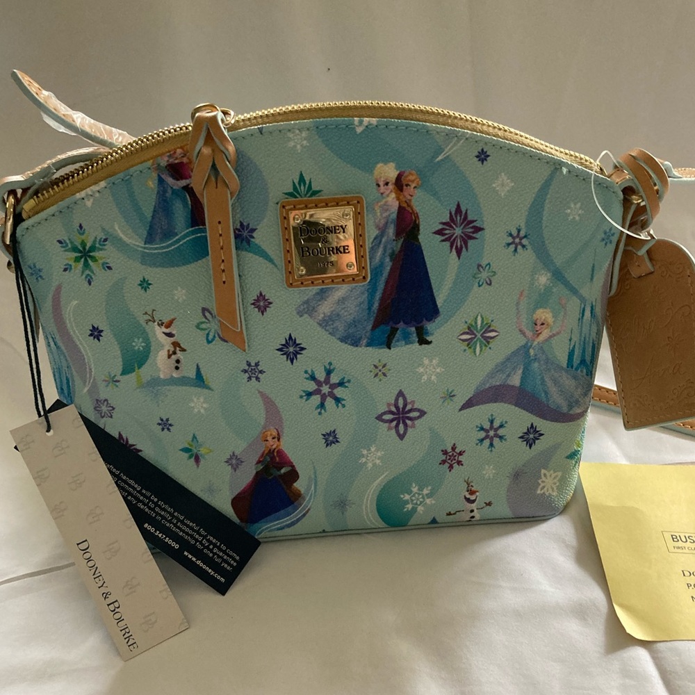 NWT Disney Frozen Dooney & Bourke crossbody. With registration card.